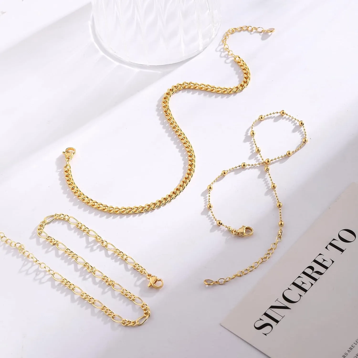 CAROVO Gold Ankle Bracelets for Women 14K Real Gold Plated Layered Anklet Waterproof Set Snake Sparkly Cuban Link Figaro Bead Paperclip Butterfly Chain Stackable Anklets Set Beach Jewelry for Women